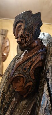 Tall carved wooden figure in the gallery