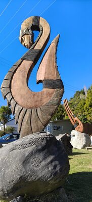 Carved hook sculpture seen from the side